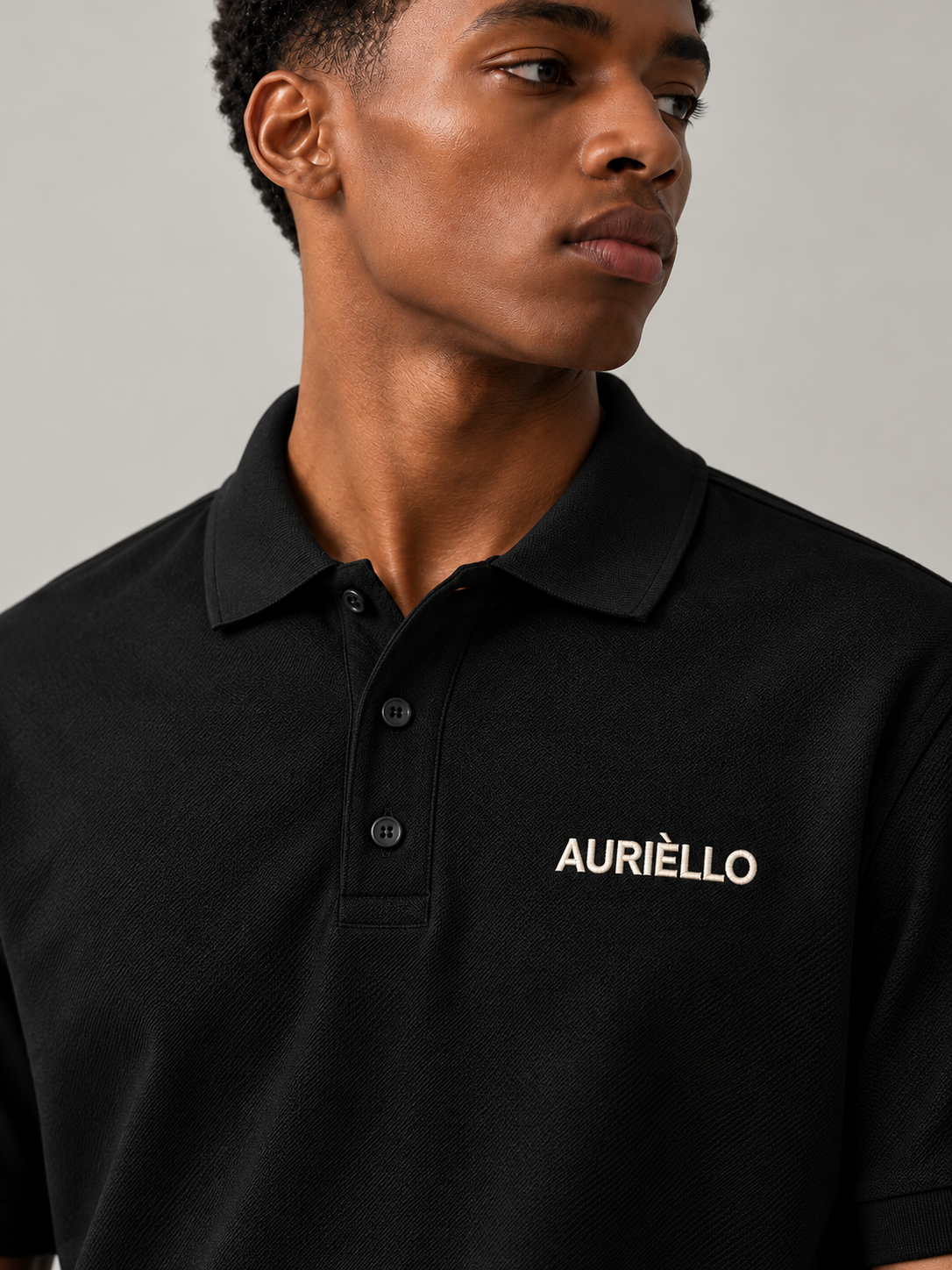 AURIÈLLO Golf T-Shirt in Black — embroidered logo detail
